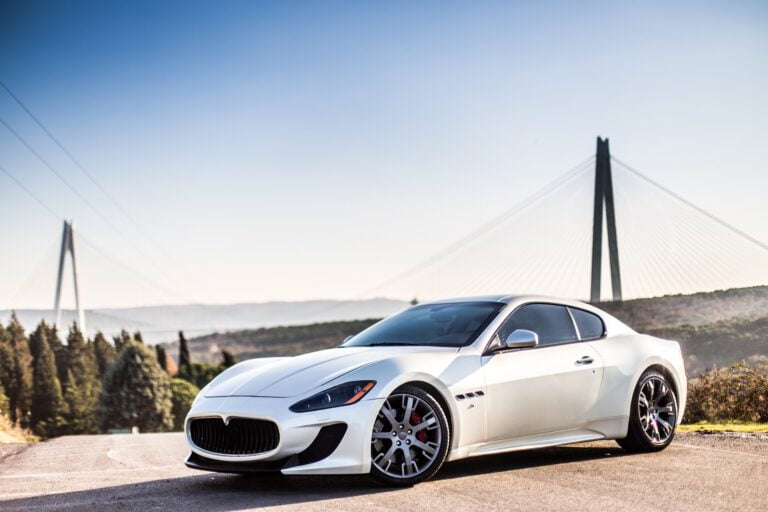 white-modern-sport-car-parking-road-after-got-the-exterior-detailing-at-ct-detailing-Louisville, KY